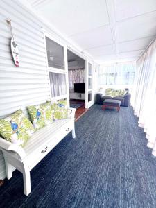 a living room with a couch and a couch at Peaceful holiday home in Margate Redcliffe in Redcliffe