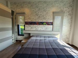 Un pat sau paturi într-o cameră la SB Holiday Resort Chiang Mai - Villa Sofia +70 fotografii