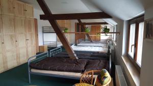 a room with two bunk beds in a room at Penzion Eqilon in Mělník