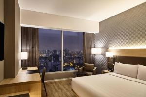 Rúm í herbergi á AC Hotel by Marriott Lima Miraflores