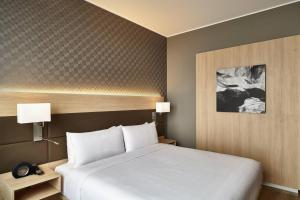 Rúm í herbergi á AC Hotel by Marriott Lima Miraflores