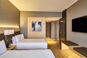 Rúm í herbergi á AC Hotel by Marriott Lima Miraflores