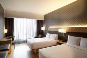 Rúm í herbergi á AC Hotel by Marriott Lima Miraflores