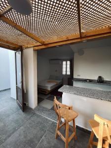 a room with a bed and a table and chairs at Unique Studio in Cairo +4 photos