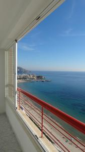 a view from a balcony of a large building with a view of the ocean at Apartamentos Beni-Beach in Benidorm