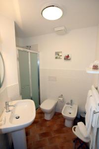 a bathroom with a sink and a toilet and a shower at B&B Teatro in Palermo +35 photos