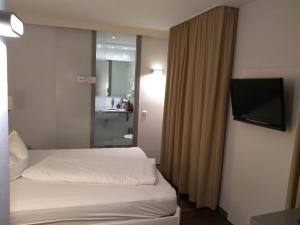 Postel nebo postele na pokoji v ubytování Altstadt Hotel Baunachshof