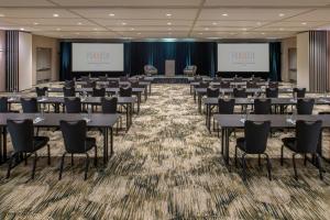 a conference room with tables and chairs in the middle at Hotel Paradox, Autograph Collection in Santa Cruz +37 photos