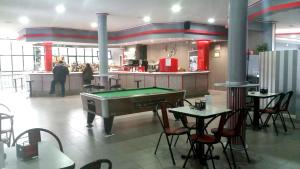 a kitchen with a pool table in a restaurant at Hotel Restaurante America in Oca