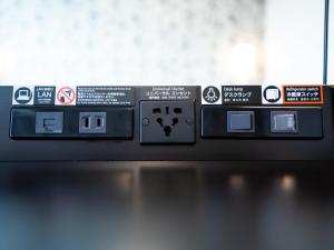 a close up of a machine with signs on it at APA Hotel Shibuya Dogenzakaue in Tokyo