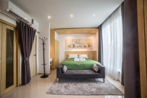 Кровать или кровати в номере The Bliss Ubon