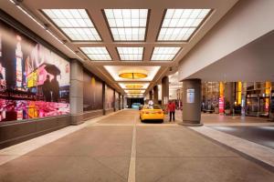 a yellow car parked in the middle of a building at New York Marriott Marquis in New York