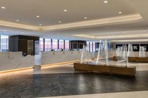 a lobby with a waiting area in a building at New York Marriott Marquis in New York