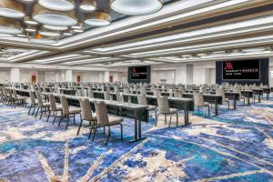 a conference room with rows of tables and chairs at New York Marriott Marquis in New York