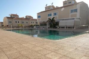 a swimming pool in front of a house at Carlos in Callao Salvaje