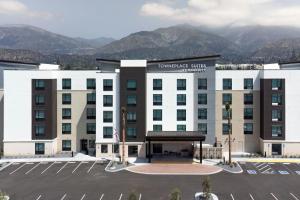 a rendering of a hotel with a parking lot at TownePlace Suites by Marriott Monrovia in Monrovia