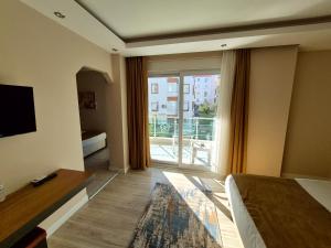 Postel nebo postele na pokoji v ubytování Toprak Apart Otel