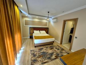 Postel nebo postele na pokoji v ubytování Toprak Apart Otel