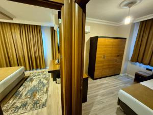 Postel nebo postele na pokoji v ubytování Toprak Apart Otel