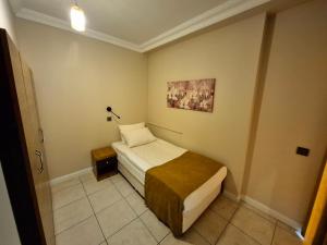Postel nebo postele na pokoji v ubytování Toprak Apart Otel