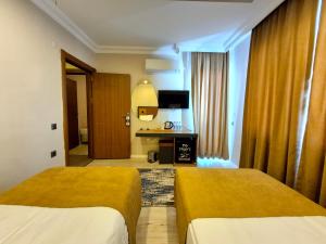 Postel nebo postele na pokoji v ubytování Toprak Apart Otel