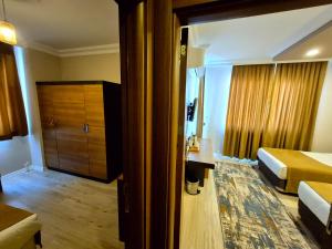 Postel nebo postele na pokoji v ubytování Toprak Apart Otel