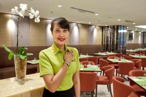 a woman standing in front of a restaurant at Centrestage Petaling Jaya in Kuala Lumpur +76 photos