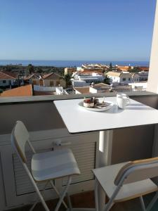 a table and chairs on a balcony with a view at Carlos in Callao Salvaje