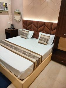 Postel nebo postele na pokoji v ubytování Hotel Grand Ganga