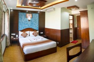 Ένα ή περισσότερα κρεβάτια σε δωμάτιο στο Samsara Boutique Hotel