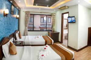Ένα ή περισσότερα κρεβάτια σε δωμάτιο στο Samsara Boutique Hotel