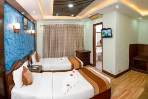 Ένα ή περισσότερα κρεβάτια σε δωμάτιο στο Samsara Boutique Hotel