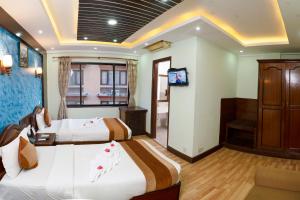 Postel nebo postele na pokoji v ubytování Samsara Boutique Hotel