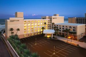 an overhead view of a hotel with the ocean behind it at Courtyard by Marriott Jacksonville Beach Oceanfront in Jacksonville Beach