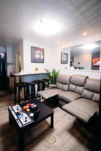 a living room with a couch and a table at Philippine Arena Staycation in Marilao Bulacan in Marilao