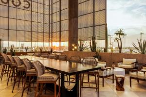 a dining room with a table and chairs at Courtyard by Marriott Mexicali in Mexicali