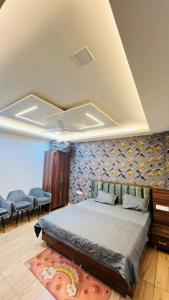 Ένα ή περισσότερα κρεβάτια σε δωμάτιο στο Hotel RUTBA