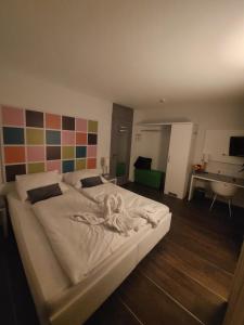 Postel nebo postele na pokoji v ubytování Altstadt Hotel Baunachshof