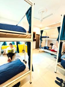 a group of people in bunk beds in a room at GreenDay Escapes Rishikesh in Rishīkesh