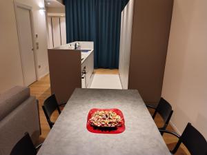 a kitchen with a table with a bowl of food on it at Davila Luxury Home in Padova