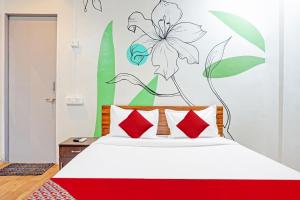 Postel nebo postele na pokoji v ubytování Hotel O Aru Sai