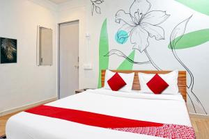 Postel nebo postele na pokoji v ubytování Hotel O Aru Sai