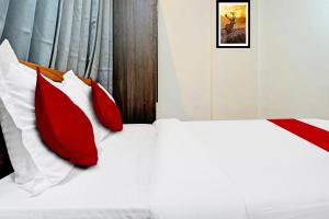 Postel nebo postele na pokoji v ubytování Hotel O Aru Sai + 27 fotografií