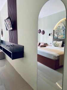 TV a/nebo společenská místnost v ubytování Rumah Baris Ubud