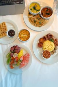 four plates of food on a table with different foods at Free House Bentota in Bentota +15 photos