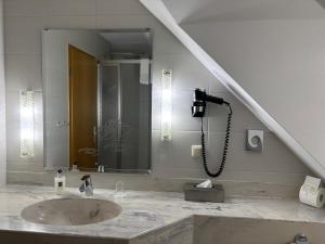 Kopalnica v nastanitvi Ambiente Hotel Strehla