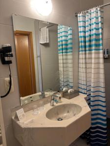 Kopalnica v nastanitvi Ambiente Hotel Strehla
