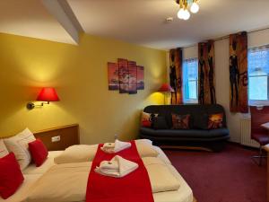 Postelja oz. postelje v sobi nastanitve Ambiente Hotel Strehla