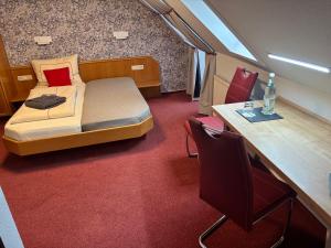 Postelja oz. postelje v sobi nastanitve Ambiente Hotel Strehla