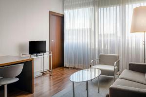 TV a/nebo společenská místnost v ubytování AC Hotel by Marriott Pisa